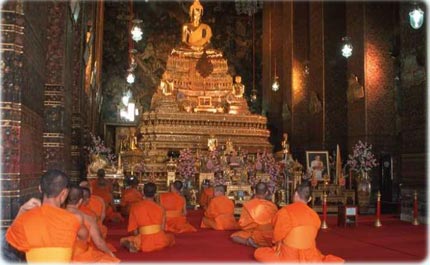 Monks in a temple in Bangkok, Thailand