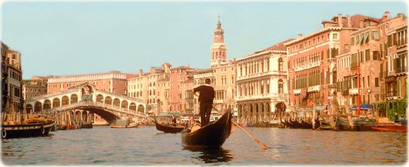 Gondolas in Venice and the Rialto bridge.